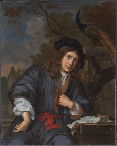 Portrait of a man seated in a garden with a peacock
