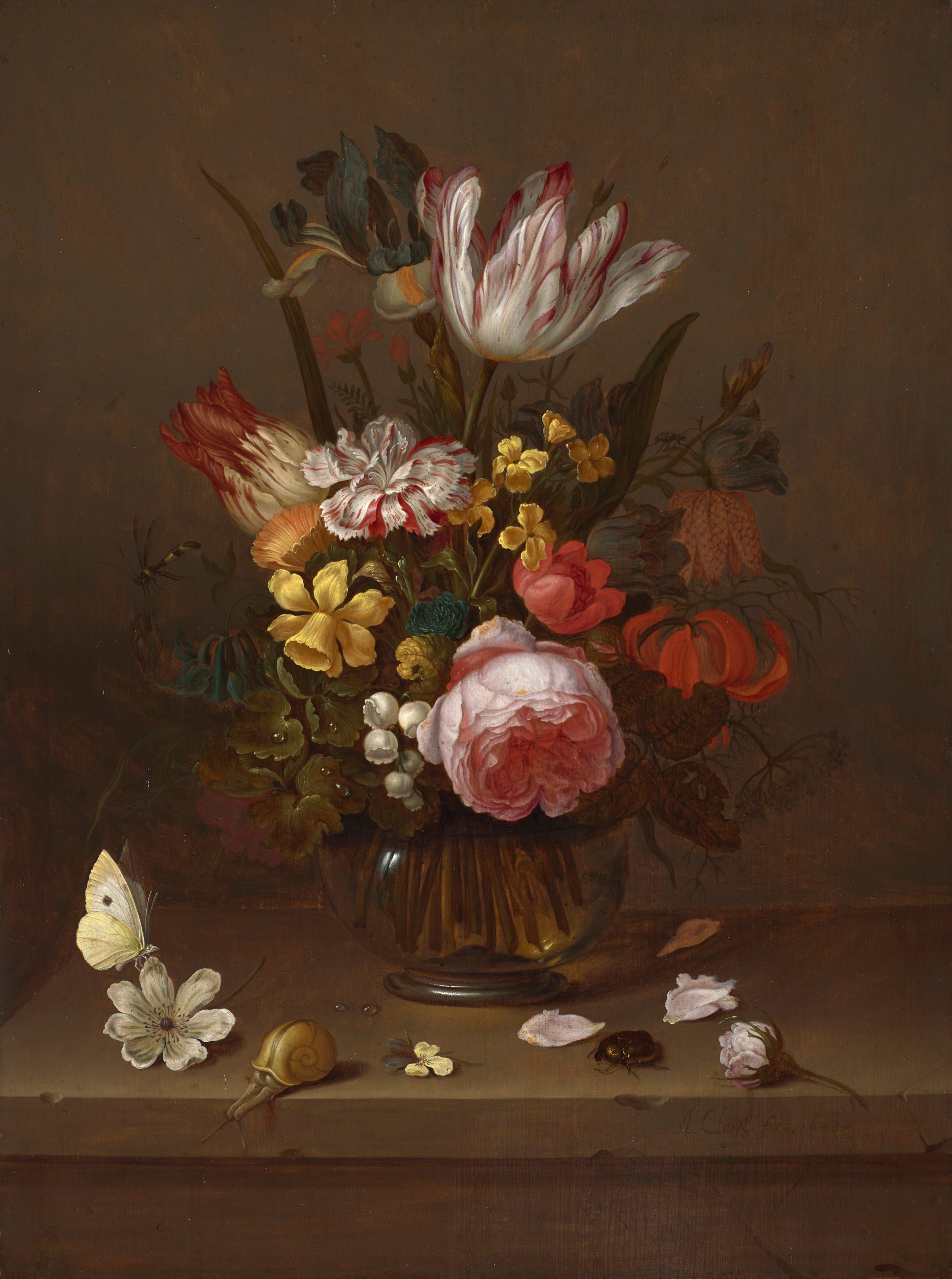 A Bouquet of Tulips, Roses, Daffodils and Carnations in a Glass Vase on the Table